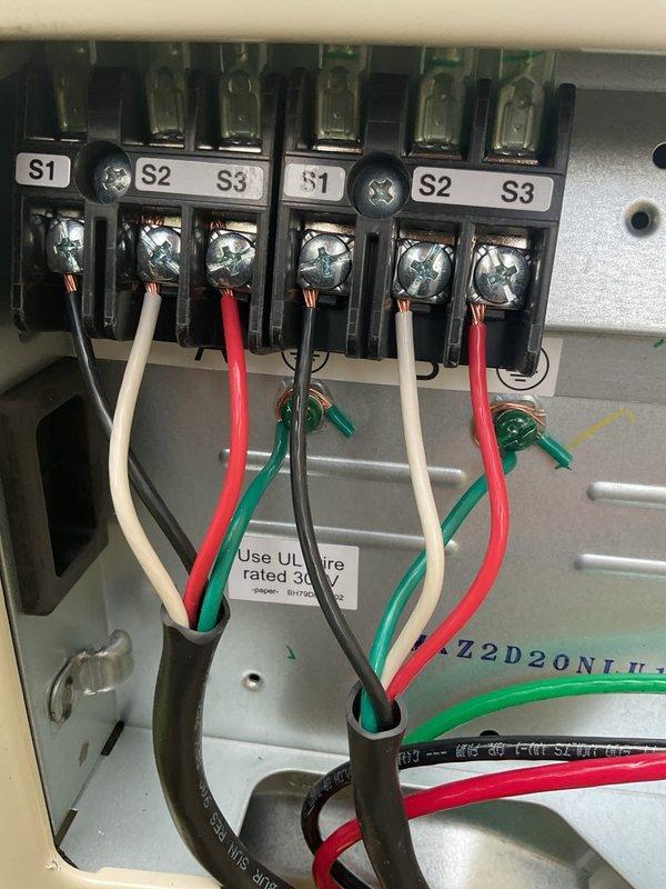 Responded to service call for newly installed Mitsubishi mini-split system with no heating or cooling operation. Diagnosed wiring issue at indoor air handler terminal connections and corrected wire assignments between heads A and B at the control panel. Verified proper operation of both zones, confirmed condensate drainage from drain lines, and identified improper condensate discharge onto window sill requiring installer callback to install PVC drainage piping away from building structure to prevent wood damage.