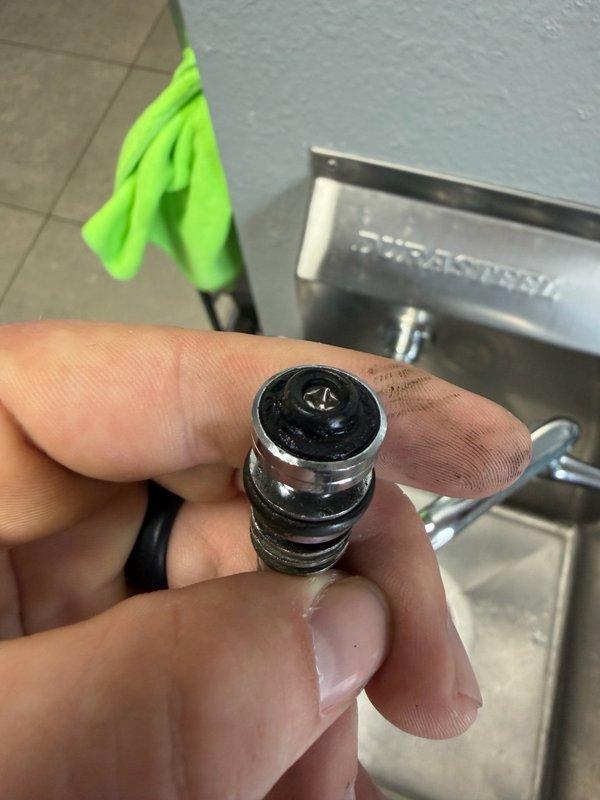 Responded to a service call for a continuously dripping prep sink that was previously installed. Upon diagnosis, identified a faulty hot side cartridge in the Durasteel faucet assembly as the source of the leak. Removed and inspected the defective cartridge, documented the failed component with photographs, and provided an estimate for cartridge replacement to resolve the dripping issue.