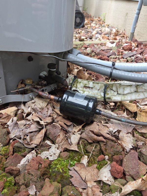Responded to a second-opinion service call on a 2017 Carrier single-stage air conditioning system with reported suction line freezing and history of repeated refrigerant leak repairs by another contractor. Upon arrival, found the air filter completely plugged, restricting airflow, and the outdoor condenser coil requiring cleaning. Performed system diagnostics and measured superheat, subcooling, and temperature split across the evaporator coil. Results showed 17°F temperature split with acceptable refrigerant charge levels at time of inspection, indicating the freezing issue was likely caused by restricted airflow rather than low refrigerant. Replaced deteriorated suction line insulation on the refrigerant line set to restore proper vapor line protection and prevent future sweating and ice formation. Recommended scheduling a furnace inspection for the 2010 Carrier Infinity system due to known heat exchanger concerns in that model year, and suggested ductwork cleaning following recent ba