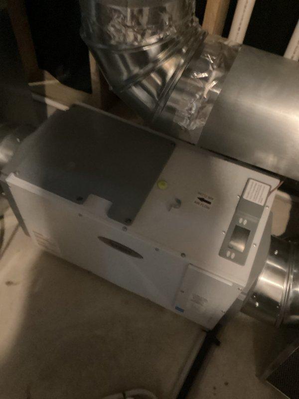 Responded to service call for whole-home dehumidifier not achieving setpoint of 40-45% relative humidity, with readings remaining at 60%. Upon inspection of the Aprilaire dehumidifier and connected HVAC system, identified that the air exchanger was introducing outdoor humid air into the system, preventing the dehumidifier from reaching target humidity levels. Deactivated the air exchanger to resolve the immediate humidity control issue, after which the system successfully reduced indoor humidity to desired levels. Advised that the air exchanger will need to be reactivated and properly configured for operation during winter months to provide adequate fresh air ventilation. Enrolled customer in rewards program for ongoing service benefits.