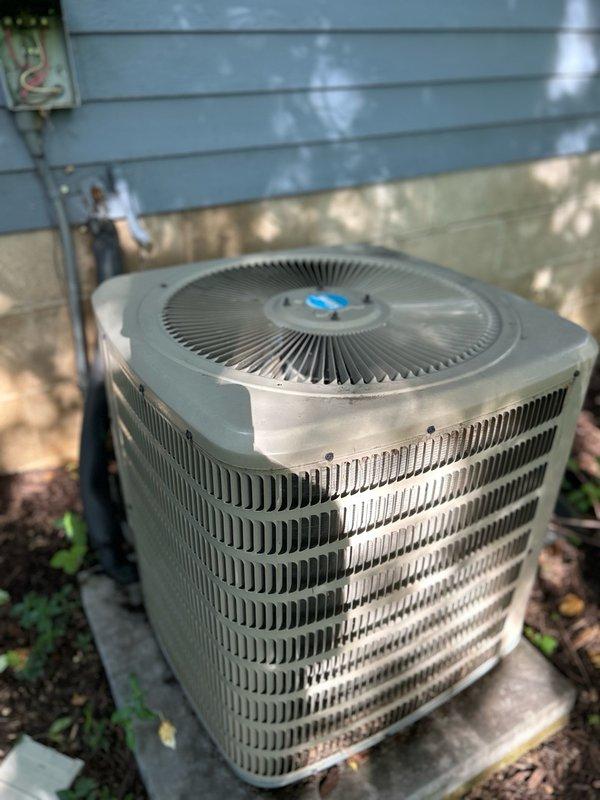 Responded to no cooling call on 10-year-old system displaying anti-frost fault code with red blinking indicator light. Upon arrival, inspected filter, blower motor, and condensate drainage system, discovering and clearing a clogged drain line. Initial refrigerant pressure readings suggested possible undercharge. Ran system in fan-only mode for two hours to allow complete thawing of frozen components. Upon return, conducted second set of refrigerant readings which indicated a restriction in the system rather than low charge. Despite high valve saturation temperature, suction line continued to freeze, confirming thermostatic expansion valve malfunction. Attempted to reposition and secure TXV sensing bulb and temperature sensors without resolution. System shut down to allow complete defrost. Diagnosed faulty TXV requiring replacement. Follow-up visit scheduled to install new thermostatic expansion valve and restore cooling operation.