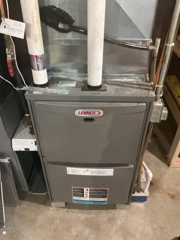 Responded to no cooling complaint on 21-year-old Lennox system. Upon inspection, found system cycling improperly with condenser shutting off prematurely while indoor blower continued to run. Used Fieldpiece manifold gauge to diagnose refrigerant levels and confirmed system is significantly low on R410A refrigerant, indicating a leak in the system. Observed water accumulation on floor around indoor unit. System requires leak detection, repair, and refrigerant recharge. Provided customer with repair estimate for R410A system work and recommended comfort advisor consultation given age of equipment.