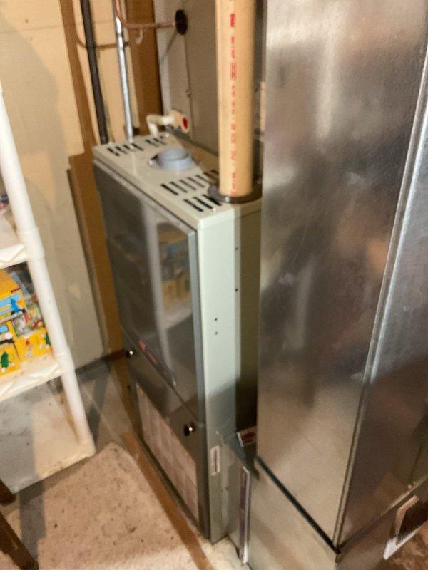 Responded to no cooling complaint on 12+ year old system where condenser fan would not run but unit attempted to start with humming noise. Diagnosed failed capacitor on outdoor condenser unit, which had visibly failed. Replaced capacitor and restored normal operation. Verified system performance with temperature drop measurement of 14°, which was acceptable given extremely high ambient humidity levels and elevated dewpoint conditions at time of testing. Performed condenser coil cleaning as part of maintenance membership benefits. System operating normally upon completion, with recommendation to monitor performance and recheck if cooling issues persist once humidity levels normalize.