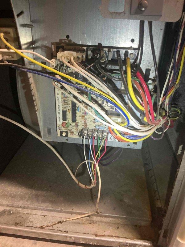 Responded to no cooling complaint on 17-year-old Lennox air conditioning system. Upon arrival, diagnosed intermittent low voltage fuse failure occurring when system engaged. Traced issue to outdoor condenser unit where rodent damage had compromised low voltage wiring, causing short circuit between exposed conductors. Replaced damaged wire section with new low voltage wiring and secured connections. During system evaluation, identified condenser fan capacitor reading out of manufacturer specifications and noted significant dirt accumulation on furnace blower wheel affecting airflow efficiency. Discussed repair options with homeowner and completed low voltage wire replacement to restore system operation.