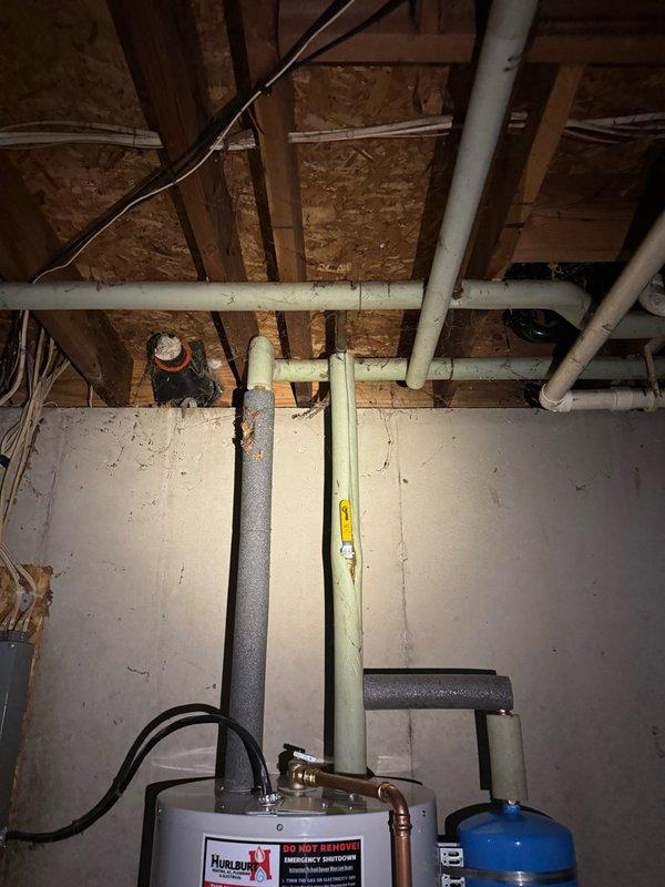 Responded to service call for leaking water heater in basement utility area. Upon inspection, found active leak originating from top heating element and tank body of existing 50-gallon electric water heater. Drained and removed failed unit from installation location. Installed new Bradford White 50-gallon electric water heater as direct replacement, including new expansion tank to protect home's water lines, fixtures, and extend tank longevity. Connected all electrical and plumbing connections to code specifications. Unit tested and verified operational with no leaks detected. Installation includes 10-year parts and tank warranty with 1-year labor warranty.