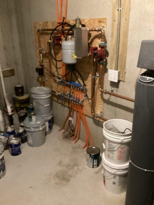Responded to service call for radiant floor heating system experiencing leaks in the supply manifold zones 8-12. Identified loose fittings on manifold connections, disassembled affected joints, applied fresh Teflon tape to threads, and retightened nuts to proper torque specifications. Verified leak-free operation of both repaired connections. Performed system flush on two zones using existing glycol/water premix and homeowner's circulation pump to remove air and ensure proper flow through radiant loops. System tested and confirmed operational with no leaks detected at manifold connections.