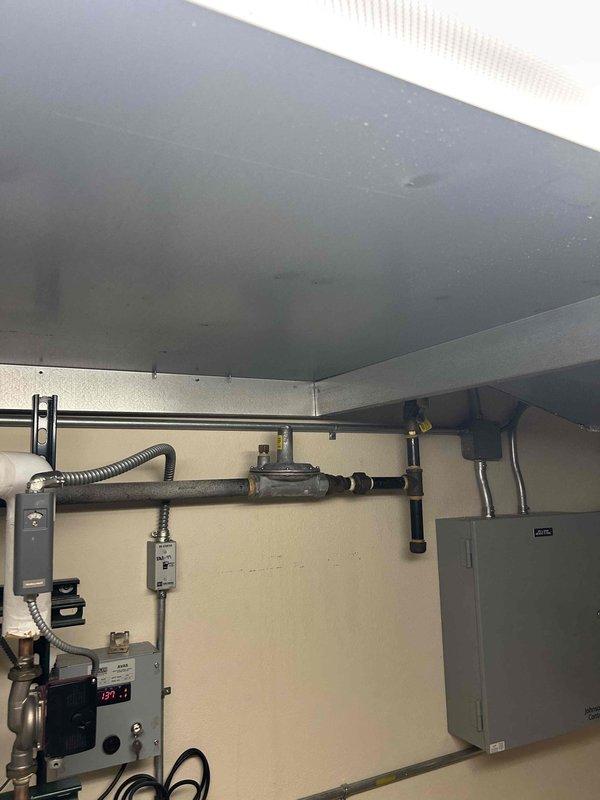 Responded to multiple A.O. Smith Vertex 199 MBtu tankless water heaters experiencing simultaneous performance issues. Verified gas fuel pressure at inlet and discovered pressure dropping significantly below the required minimum of 1 inch water column during operation. Attempted to boost gas pressure to restore proper function, but units continued to fail under load conditions. Diagnosed inadequate gas supply as root cause affecting multiple water heaters concurrently. Documented existing conditions including water heater installations, gas piping system, pressure regulation equipment, and utility connections. Provided quote for necessary gas supply system repairs to restore proper operating pressure and water heater functionality.
