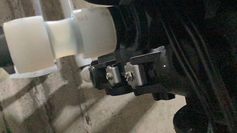 Responded to water leak at treatment tower system where both drain fittings were found cracked and failing. Removed and replaced both drain adapter fittings, re-taped PEX adapters to ensure proper seal, and noted that supply lines connecting to tanks may be under warranty from original installation. System tested and leak resolved.