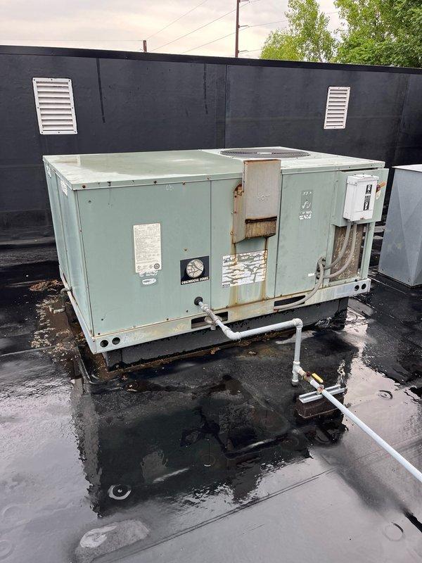 Performed second opinion diagnostic on commercial rooftop unit reported to have failed compressor. Upon inspection and system startup, confirmed compressor is grinding internally and failing to adequately pump refrigerant, resulting in insufficient cooling capacity. Unit is approximately 20 years old, contains obsolete R-22 refrigerant, and shows significant exterior weathering and rust deterioration. Discussed repair versus replacement options with property owner, who requested pricing for both compressor replacement and complete unit changeout given the age and condition of existing equipment.
