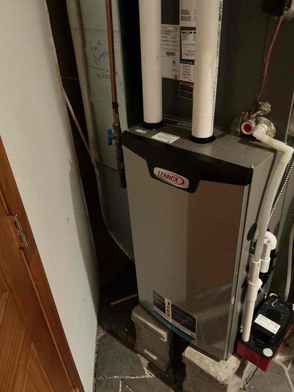 Responded to no cooling complaint on 1-year-old Lennox system. Upon inspection, determined thermostat was set to permanent hold at incorrect temperature, preventing system from cooling to desired setpoint. Corrected thermostat programming by removing permanent hold and restoring scheduled operation. Provided customer education on proper thermostat settings and operation. Verified system cycled on properly and cooling function restored to normal operation.