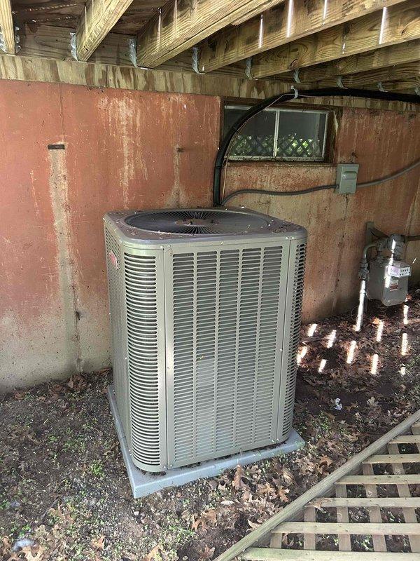 Responded to no cooling complaint on one-year-old residential air conditioning system. Upon arrival, confirmed outdoor condenser fan motor was completely seized and inoperative, causing unit to overheat with no airflow across condenser coil. Successfully freed seized motor shaft, restoring rotation and proper operation. System tested and verified cooling normally with proper airflow and temperature differential. Advised customer that condenser fan motor requires warranty replacement due to premature failure and placed parts order for permanent repair. Unit operational and providing adequate cooling until warranty motor arrives for installation.