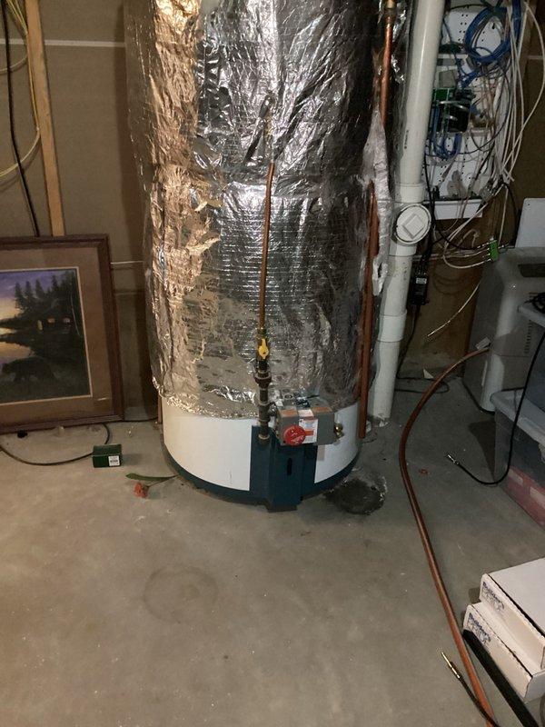 Responded to service call for leaking temperature and pressure relief valve on tanked water heater and clogged kitchen sink drain. Upon inspection, discovered the T&P valve was dripping and required replacement. Additionally, identified a cracked 3-inch PVC 90-degree elbow fitting on the water heater vent pipe that posed a potential safety hazard. Snaked the kitchen drain to clear the obstruction and restore proper drainage. Replaced the faulty T&P relief valve and installed new 3-inch PVC 90-degree elbow on the vent system above the water heater to ensure proper venting and code compliance.