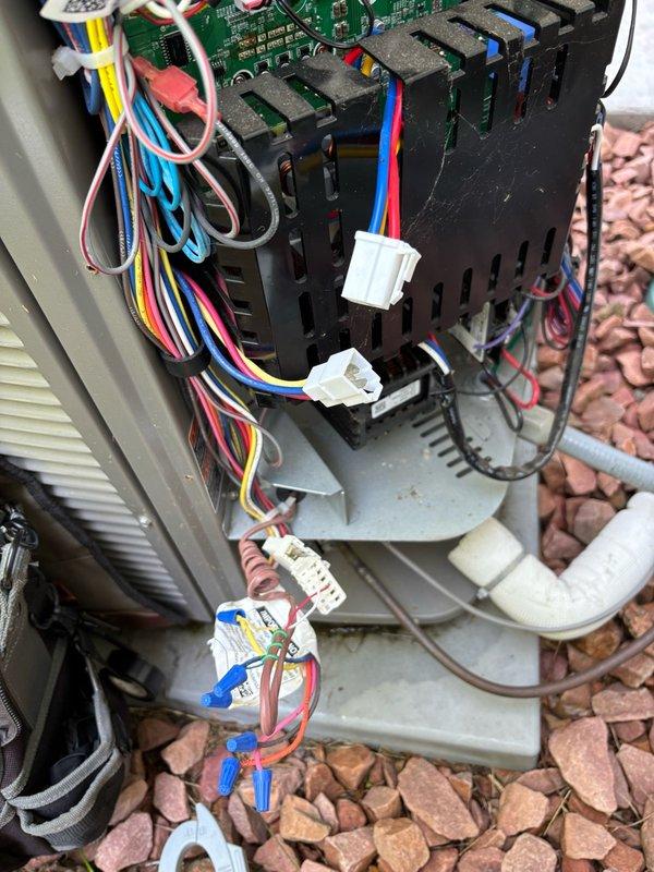 Responded to no cooling complaint on 4-year-old Lennox EL18XCVS036 variable-speed air conditioning system. Upon arrival, verified unit was completely non-operational with no cooling output throughout home. 

Performed comprehensive diagnostic evaluation of outdoor unit. Measured incoming line voltage at 244-245 VAC and control voltage at 27.4 VAC, both within acceptable parameters. Confirmed cooling demand present on control board (display showing -- 2 code) and verified contactor was properly engaged. Despite proper electrical supply and control signals, compressor remained idle with no attempt to start.

Conducted compressor winding resistance testing using digital multimeter. Measured 1 ohm resistance across U-V, V-W, and U-W terminals, indicating balanced windings. Tested insulation resistance to ground on all three phases, recording open line (OL) readings, confirming compressor windings were electrically sound with no ground faults. Based on these measurements, determined compres