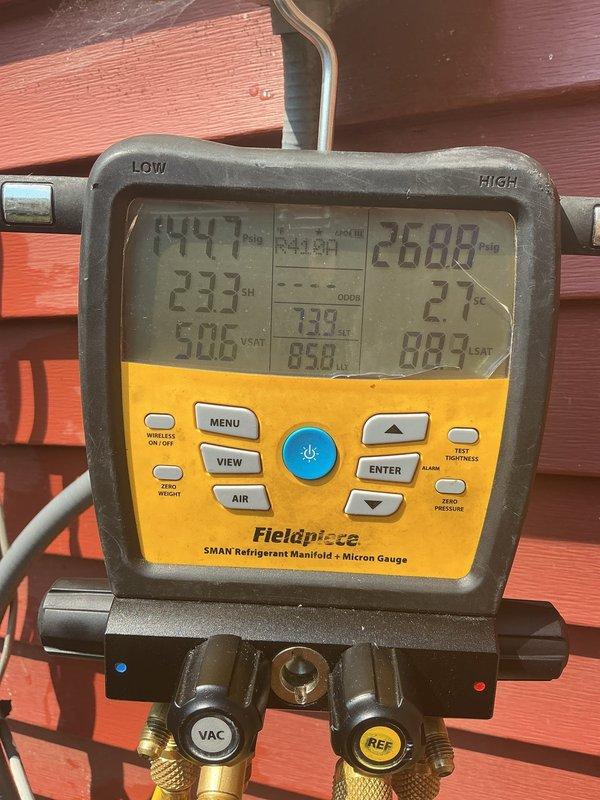 Responded to no cooling complaint on 14-year-old air conditioning system. Upon inspection, discovered burnt wiring at capacitor caused by hard start kit wires contacting high voltage power supply. Rewired electrical connections to capacitor and hard start kit, ensuring proper separation from high voltage components. Cleaned condenser coil to improve heat transfer efficiency. 

Performed refrigerant system diagnostics using manifold gauges, which revealed low subcooling readings indicating refrigerant leak in system. Based on service history showing previous recharge without leak repair and current age of equipment, recommended system replacement. Scheduled same-day estimate for new air conditioning installation.
