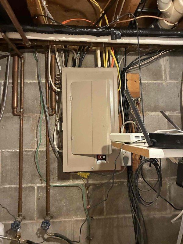 Responded to no cooling complaint on residential HVAC system. Upon arrival, discovered blown 3-amp low voltage fuse at furnace panel and corroded thermostat batteries. Investigation revealed primary failure caused by damaged low voltage thermostat wiring at exterior location with exposed bare conductors, likely from weed trimmer contact. Secondary damage identified to furnace transformer resulting from oversized fuse installation during troubleshooting attempt. Outdoor condenser coil found heavily restricted with debris accumulation.

Replaced 3 feet of damaged thermostat wire at exterior run and added insulation to exposed suction line. Performed complete condenser coil cleaning to restore proper airflow. Replaced failed transformer and installed correct amperage fuse at furnace. Inspected all electrical components and connections for proper operation. 

Verified system operation through extended run cycle of 20-30 minutes. Confirmed proper condensate drainage and measured 20-degree t