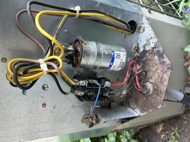 Responded to no-cooling complaint on 15-year-old residential central air conditioning system. Upon inspection, discovered failed dual-run capacitor and rodent nest obstructing airflow within outdoor condensing unit. Replaced defective capacitor with proper OEM-specification component. Performed thorough cleanout of condenser coil and cabinet, removing all debris and nesting material. Washed condenser coil to restore proper heat transfer efficiency.

Following mechanical repairs, performed refrigerant system diagnostics using manifold gauge set. Testing revealed system operating with insufficient refrigerant charge, indicating potential leak in refrigeration circuit. Given the age of the equipment and multiple compounding failures, provided comprehensive repair versus replacement options to customer. Due to cost-effectiveness considerations and system age exceeding typical service life expectancy, customer elected to schedule consultation with service advisor for full system replacement