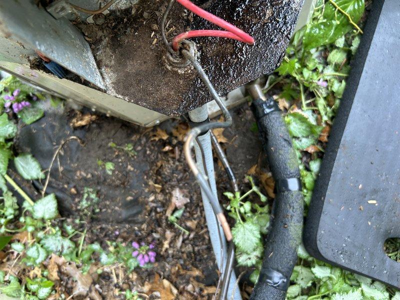 Responded to no-cooling complaint on 15-year-old residential central air conditioning system. Upon inspection, discovered failed dual-run capacitor and rodent nest obstructing airflow within outdoor condensing unit. Replaced defective capacitor with proper OEM-specification component. Performed thorough cleanout of condenser coil and cabinet, removing all debris and nesting material. Washed condenser coil to restore proper heat transfer efficiency.

Following mechanical repairs, performed refrigerant system diagnostics using manifold gauge set. Testing revealed system operating with insufficient refrigerant charge, indicating potential leak in refrigeration circuit. Given the age of the equipment and multiple compounding failures, provided comprehensive repair versus replacement options to customer. Due to cost-effectiveness considerations and system age exceeding typical service life expectancy, customer elected to schedule consultation with service advisor for full system replacement