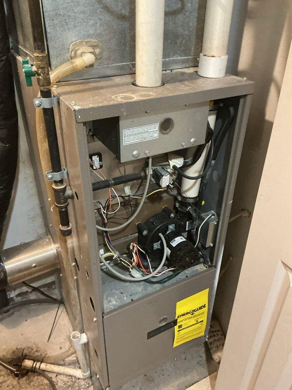 Responded to no-cool complaint on 5-year-old Goodman GSX130241FA system where outdoor condenser unit failed to activate when thermostat was set to cooling mode. Upon inspection, discovered the common wire (C-wire) was disconnected from the furnace control board, preventing proper communication between thermostat and outdoor unit. Reconnected C-wire to control board terminal, verified proper voltage at thermostat, and tested system operation through complete cooling cycle. Condenser unit activated properly, and system returned to normal cooling function.