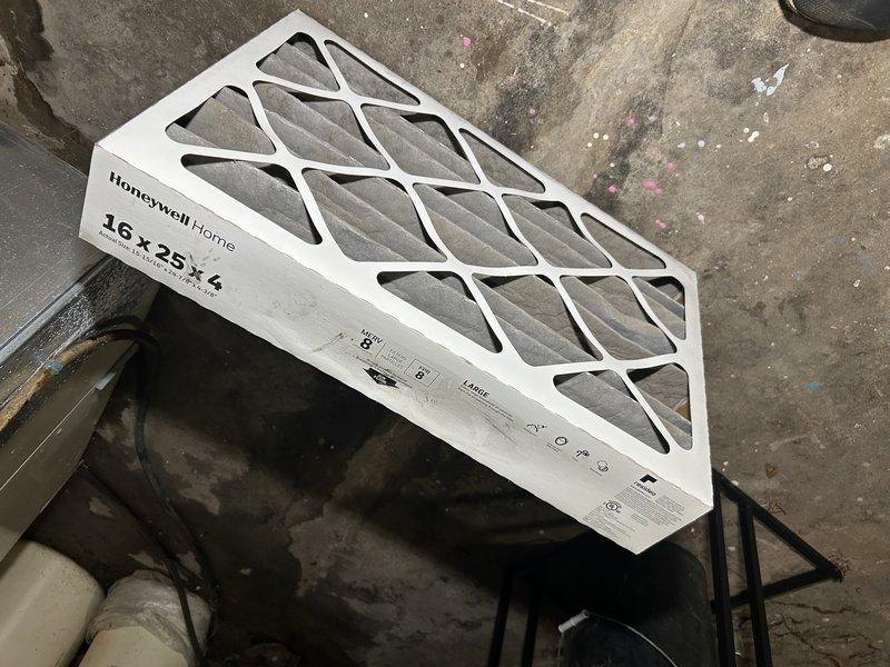 Responded to no cooling complaint on 23-year-old R-22 system with 6-degree temperature differential between setpoint and actual room temperature. Upon arrival, found evaporator coil completely frozen, preventing proper heat exchange and airflow. Homeowner reported previous refrigerant recharge performed several years ago, indicating potential ongoing leak in system. Due to frozen condition of coil, unable to perform complete diagnostic testing including static pressure measurements at time of service.

Documented existing system configuration including ECM blower motor in current furnace. Observed ongoing comfort issues with inadequate cooling to second floor, consistent with possible airflow restrictions, undersized ductwork, or insufficient system capacity for multi-level application. Previous technician had attempted to address zoning issues through manual damper adjustments at supply registers.

Provided detailed explanation of R-22 refrigerant phase-out, leak repair options, and a