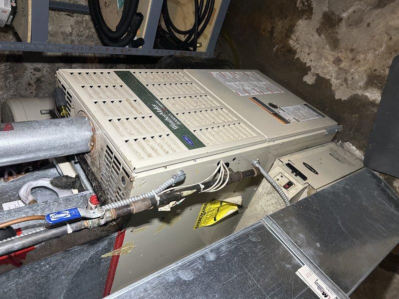 Responded to no cooling complaint on 23-year-old R-22 system with 6-degree temperature differential between setpoint and actual room temperature. Upon arrival, found evaporator coil completely frozen, preventing proper heat exchange and airflow. Homeowner reported previous refrigerant recharge performed several years ago, indicating potential ongoing leak in system. Due to frozen condition of coil, unable to perform complete diagnostic testing including static pressure measurements at time of service.

Documented existing system configuration including ECM blower motor in current furnace. Observed ongoing comfort issues with inadequate cooling to second floor, consistent with possible airflow restrictions, undersized ductwork, or insufficient system capacity for multi-level application. Previous technician had attempted to address zoning issues through manual damper adjustments at supply registers.

Provided detailed explanation of R-22 refrigerant phase-out, leak repair options, and a