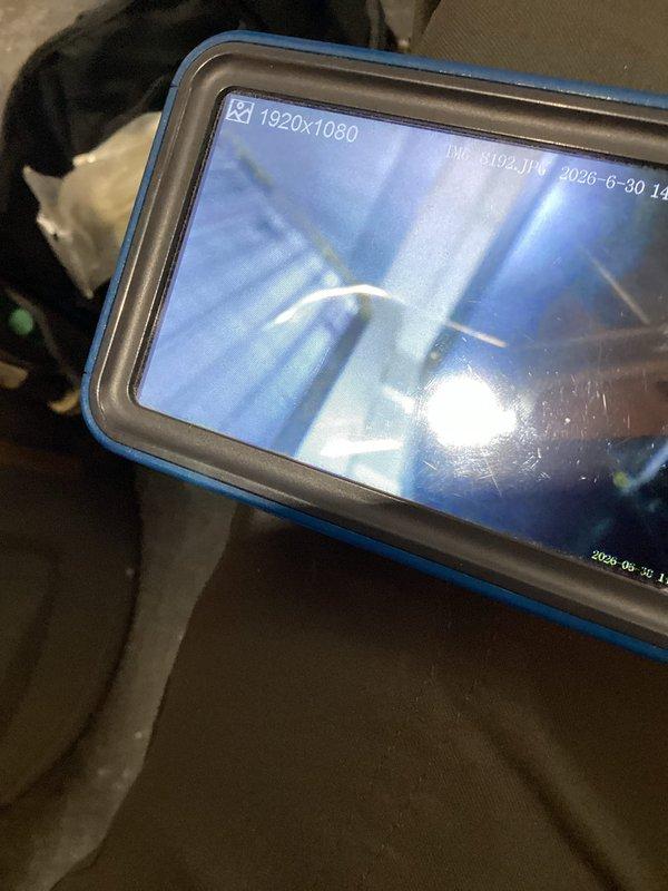 Responded to no cooling call and discovered water leaking from furnace unit due to condensate drainage issue. Upon inspection with camera equipment, determined the drain pan was compromised and leaking internally despite the external drain line being clear. Replaced the defective drain pan to resolve the water leak and restore proper condensate drainage function.