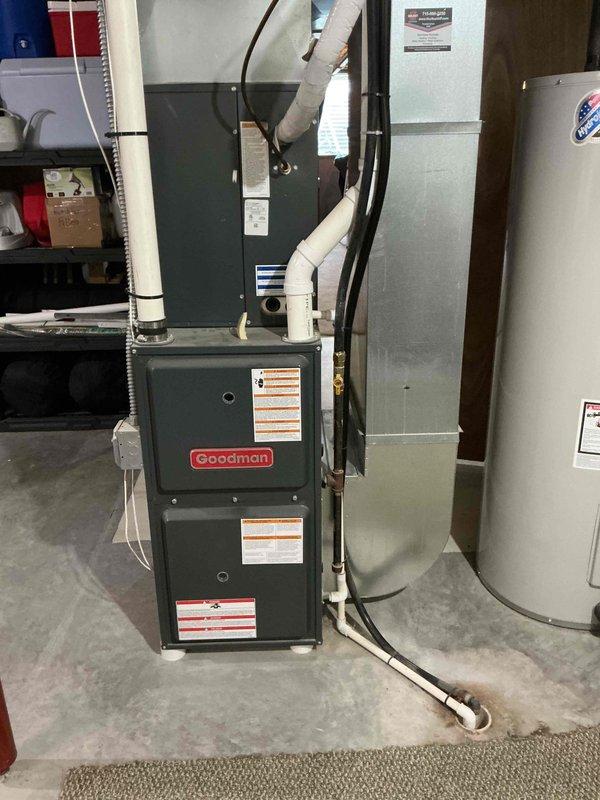 Responded to no cooling complaint on 9-year-old residential AC system. Found outdoor unit not operating despite contactor clicking. Diagnostics revealed tripped breaker at electrical panel, which occurred after thermostat battery replacement. Reset breaker, restored power to outdoor unit, and verified compressor and condenser fan motor operation. Tested all system components and confirmed proper operation with 20-degree temperature split across evaporator coil.