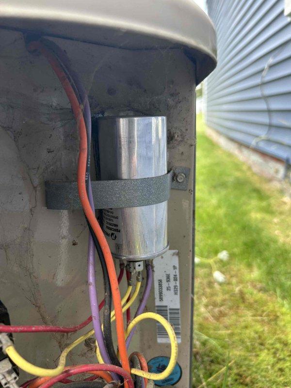 Responded to no cooling complaint on 1999 Lennox air conditioning system with reported buzzing noise from outdoor unit. Upon inspection, diagnosed failed run capacitor causing compressor malfunction. Replaced defective capacitor with new component, restored power, and verified proper system operation with 15-degree delta T across evaporator coil, confirming adequate cooling performance.