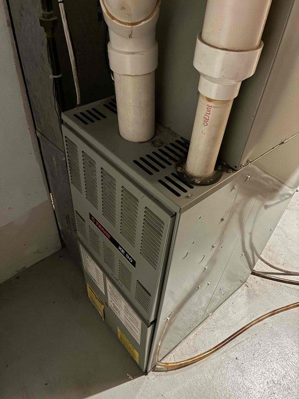 Responded to no cooling call on residential HVAC system. Upon arrival, customer reported condenser humming but fan not operating. Diagnosed locked blower motor on furnace unit originally installed in 1994. Given the 32-year age of the equipment, recommended full system replacement rather than component repair. Customer agreed to replacement option, and comfort advisor appointment was scheduled for the following morning. System was left in off position for safety until replacement. Provided estimate for blower motor replacement as backup option, though customer indicated preference for complete equipment replacement.