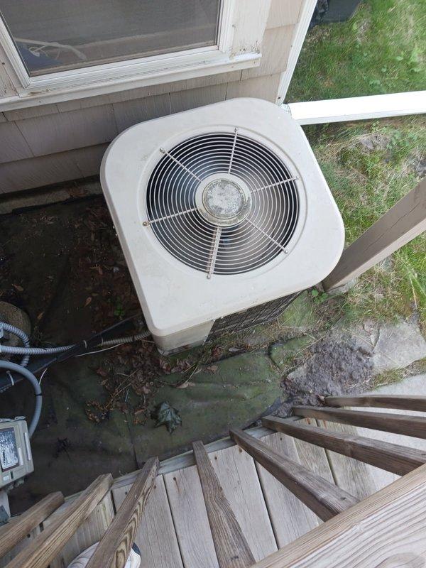 Responded to no cooling complaint with 5-degree temperature differential between thermostat setting and actual indoor temperature. Diagnosed 1999 air conditioning system with critically low R22 refrigerant charge. Due to age of equipment (24 years old), obsolete refrigerant type, and cost of R22, recommended complete system replacement rather than recharge.