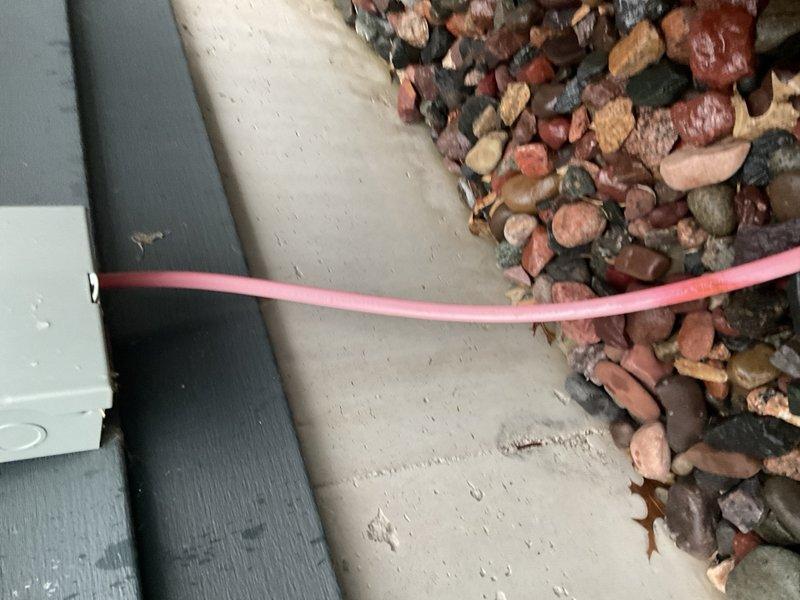 Responded to no cooling complaint on 2021 Amana air conditioning system with condenser fan running but no interior cooling. Diagnostic testing revealed failed dual run capacitor rated 40/5 µF—compressor section measured 0 µF while fan section read 5 µF. Replaced defective capacitor with new 40/5 µF unit, restarted system, and verified proper operation with 20°F supply/return temperature split after ten minutes of runtime. System restored to normal cooling operation.