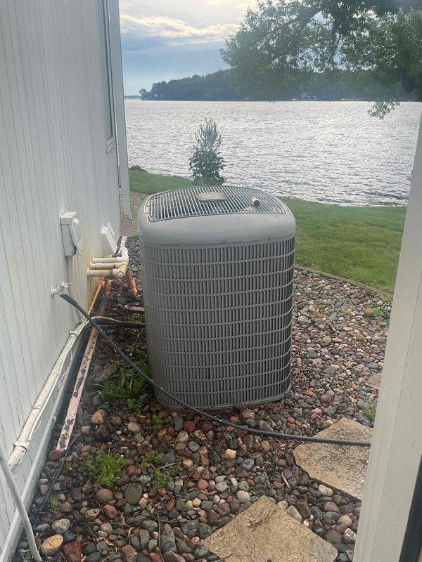 Responded to no cooling complaint on residential air conditioning system. Upon inspection, found system low on refrigerant and dirty air filter restricting airflow. Replaced air filter, recharged system with refrigerant to manufacturer specifications, and added UV dye to aid in future leak detection if necessary. System tested and confirmed cooling properly upon departure.