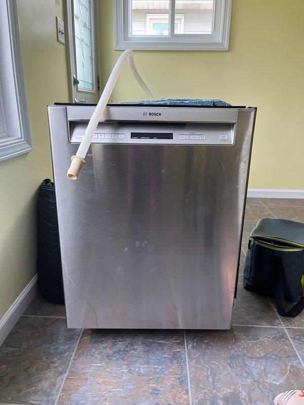 Installed customer-supplied Frigidaire dishwasher, including proper connection of water supply and drain lines, and removed existing Bosch dishwasher unit. Replaced leaking shower head fixture to resolve water leak issue. Provided quote for disposal of old dishwasher unit.