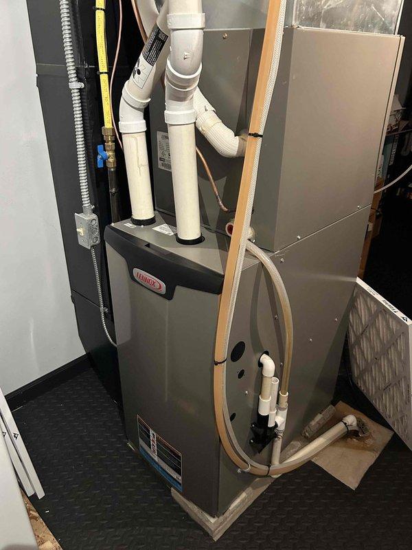 Completed comprehensive AC tune-up and clean-and-check service on 6-year-old Lennox system. Inspected all components including indoor furnace unit and outdoor condenser, verified proper operation of electrical connections, refrigerant lines, condensate drainage, and airflow systems. All equipment found operating within normal parameters with effective cooling performance and no deficiencies noted at time of service.