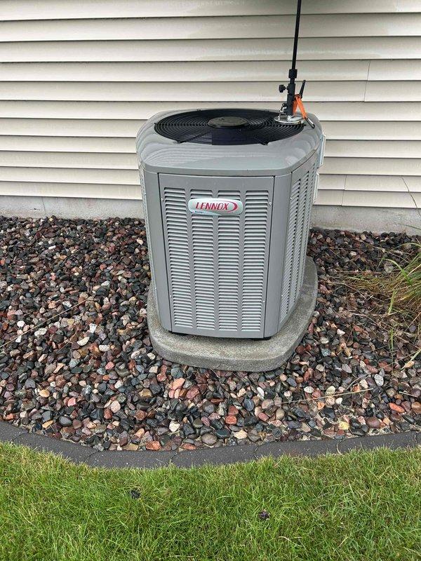 Completed comprehensive AC tune-up and clean-and-check service on 6-year-old Lennox system. Inspected all components including indoor furnace unit and outdoor condenser, verified proper operation of electrical connections, refrigerant lines, condensate drainage, and airflow systems. All equipment found operating within normal parameters with effective cooling performance and no deficiencies noted at time of service.