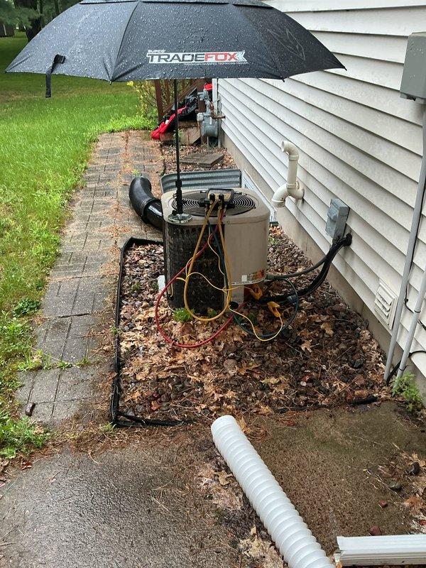 Responded to no cooling complaint on 10+ year old R22 air conditioning system that had previously frozen up. Upon arrival, system had been off and evaporator coil was fully thawed. Performed diagnostic testing using refrigerant manifold and gauges, which revealed system was significantly low on R22 refrigerant charge. Measured operating pressures and temperatures on both low and high side of system. Low refrigerant charge was determined to be primary cause of freezing and loss of cooling capacity. Added R22 refrigerant to bring system back to proper operating charge levels. Verified proper system operation with corrected pressures and temperatures after recharge. System restored to normal cooling operation.
