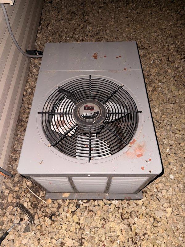 Responded to no-cool condition on 14-year-old residential air conditioning system. Upon inspection, diagnosed failed capacitor preventing outdoor fan operation and found condenser coils heavily soiled with dirt and debris. Replaced defective capacitor with OEM equivalent and performed thorough coil cleaning by rinsing exterior surfaces to restore proper airflow and heat transfer. Verified refrigerant charge within manufacturer specifications with no leaks detected. Tested all electrical components, contactors, and compressor operation—all systems functioning properly and within normal parameters. Unit restored to full cooling capacity and left in operational condition.