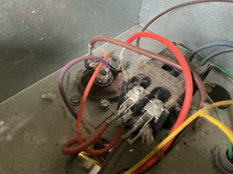 Responded to no-cool condition on 14-year-old residential air conditioning system. Upon inspection, diagnosed failed capacitor preventing outdoor fan operation and found condenser coils heavily soiled with dirt and debris. Replaced defective capacitor with OEM equivalent and performed thorough coil cleaning by rinsing exterior surfaces to restore proper airflow and heat transfer. Verified refrigerant charge within manufacturer specifications with no leaks detected. Tested all electrical components, contactors, and compressor operation—all systems functioning properly and within normal parameters. Unit restored to full cooling capacity and left in operational condition.