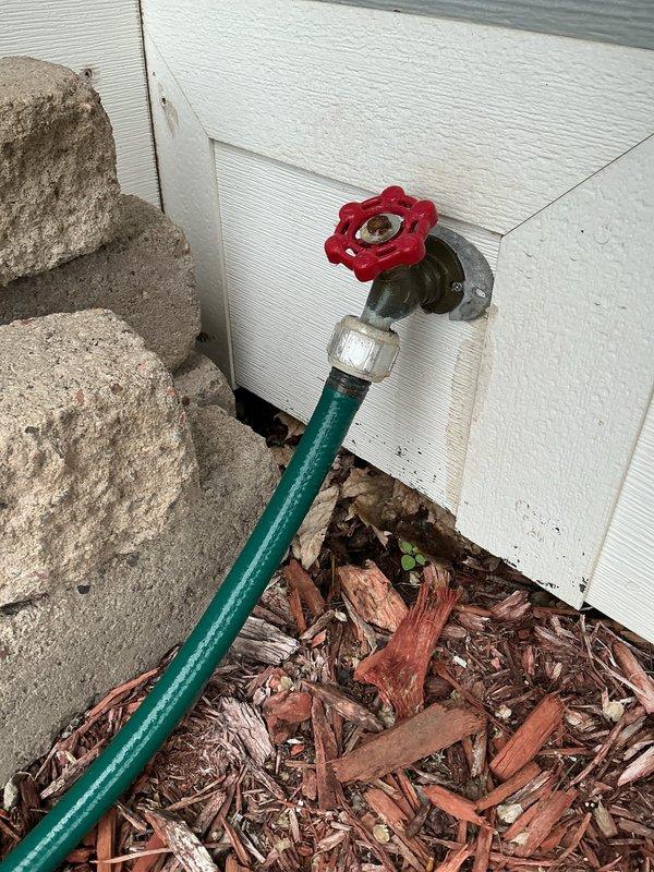 Responded to service call for two leaking outdoor hose spigots that would not shut off completely. Upon diagnostic inspection, determined that internal seals were destroyed on both spigots and the rear spigot had a broken handle. Successfully removed and replaced the front hose spigot with a new frost-free unit by cutting an access hole in the interior ceiling. Relocated the shut-off valve to a more accessible position for future maintenance and installed an access panel to cover the ceiling opening. Tested all connections and valve operation to confirm proper function with no leaks present. Provided quote for replacement of the rear spigot to address remaining issue.