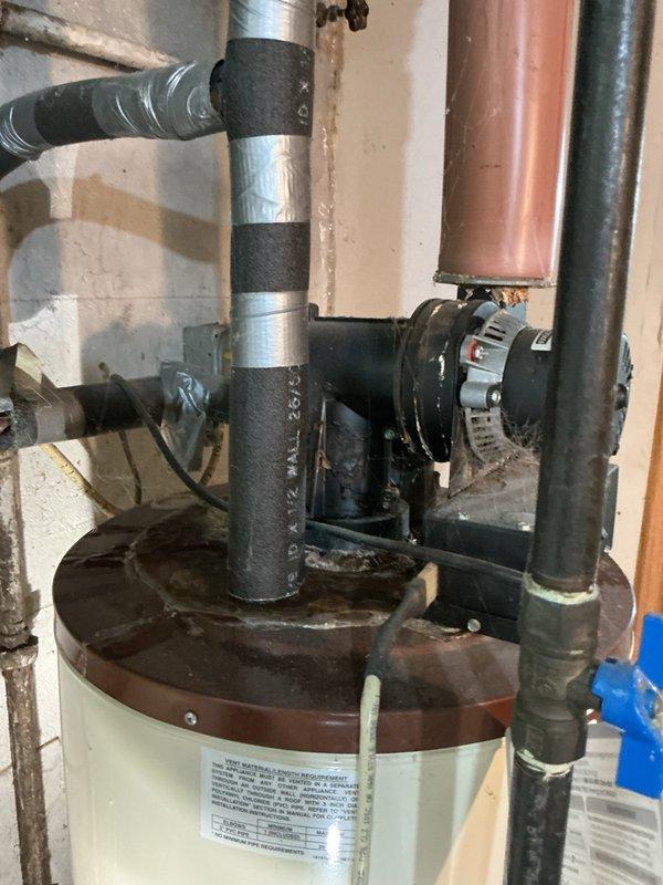 Responded to a water heater leak at a residential property. Upon inspection, identified a 45-gallon natural gas power vent water heater, over 10 years old, actively leaking from the top connections. Determined the unit required full replacement due to age and extent of deterioration. Documented the existing A.O. Smith power vent installation with photographs showing the leaking connections, power vent motor assembly, copper supply lines, and overall system configuration. Provided replacement options for both 40-gallon and 50-gallon natural gas power vent units suitable for the existing installation location and venting requirements. Awaiting customer decision on replacement sizing and scheduling.