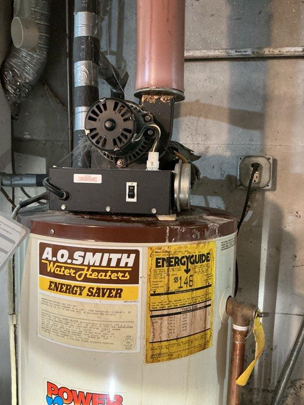Responded to a water heater leak at a residential property. Upon inspection, identified a 45-gallon natural gas power vent water heater, over 10 years old, actively leaking from the top connections. Determined the unit required full replacement due to age and extent of deterioration. Documented the existing A.O. Smith power vent installation with photographs showing the leaking connections, power vent motor assembly, copper supply lines, and overall system configuration. Provided replacement options for both 40-gallon and 50-gallon natural gas power vent units suitable for the existing installation location and venting requirements. Awaiting customer decision on replacement sizing and scheduling.