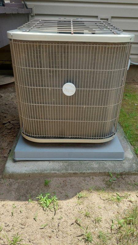 Responded to no cooling complaint on 10+ year old residential AC unit. Upon arrival, found system running with indoor blower operational and outdoor condenser fan running, but unit blowing warm air. Diagnosed severely restricted condenser coil with minimal airflow through top discharge, causing inadequate heat rejection and loss of cooling capacity.

Performed complete system tune-up with customer authorization. Disassembled outdoor unit housing and thoroughly cleaned condenser coil, removing accumulated dirt and debris. Flushed coil until completely clear and airflow restored to proper levels. 

During electrical inspection, tested dual run capacitor and found readings below manufacturer specifications. Recommended immediate replacement to prevent compressor failure and potential service callback. Installed new capacitor rated to OEM specifications.

Reassembled unit and conducted operational testing. Verified proper compressor amperage, fan operation, and refrigerant pressures. Measu