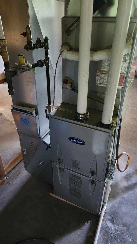 Responded to no cooling complaint on 8-year-old Carrier air conditioning system. Upon inspection, discovered rodent intrusion had damaged the dual run capacitor, rendering the system inoperative. Replaced failed dual capacitor and verified system operation. Performed complete system diagnostics including contactor inspection, refrigerant charge verification, amp draw measurements on compressor and condenser fan motor, condenser coil cleanliness check, and supply/return air temperature differential testing. All parameters tested within manufacturer specifications. System restored to full cooling operation with adequate temperature drop across evaporator coil.
