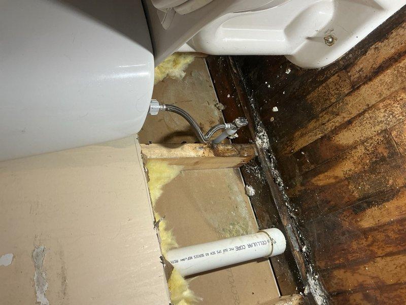 Responded to reports of PVC piping leaking in multiple locations throughout the basement. Upon arrival, conducted thorough inspection to locate source of water intrusion. Initial assessment revealed active leak originating from basement level with moisture tracking upward through structure.

Performed detailed investigation which required opening a section of wall on the main level to access concealed plumbing. Inspection revealed compromised cold water supply line feeding toilet fixture. The braided flex supply line connection showed signs of failure, resulting in water seepage behind wall cavity and subsequent damage to surrounding building materials including insulation, drywall, and flooring.

Isolated water supply to affected area and removed failed supply line. Installed new braided stainless steel flex connector to cold water supply feeding toilet. Verified all connections were secure and leak-free. Restored water supply and pressure-tested repair to ensure proper function. Conf
