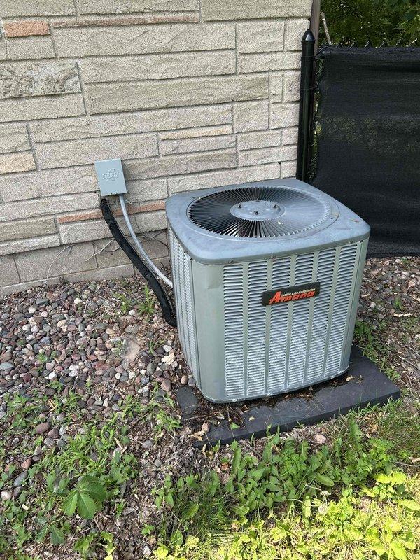 Responded to no cooling complaint on residential air conditioning system. Upon arrival, found evaporator coil completely iced over. Activated furnace heat mode to thaw frozen coil. After thaw cycle completed, verified airflow was adequate throughout system. Connected manifold gauges and performed refrigerant charge analysis, revealing system was significantly low on refrigerant charge. Added approximately 2 pounds of refrigerant to restore proper system operation. Verified unit was cooling properly upon departure. Discussed with homeowner potential need for future leak detection and repair services given the low refrigerant condition on this aging system.