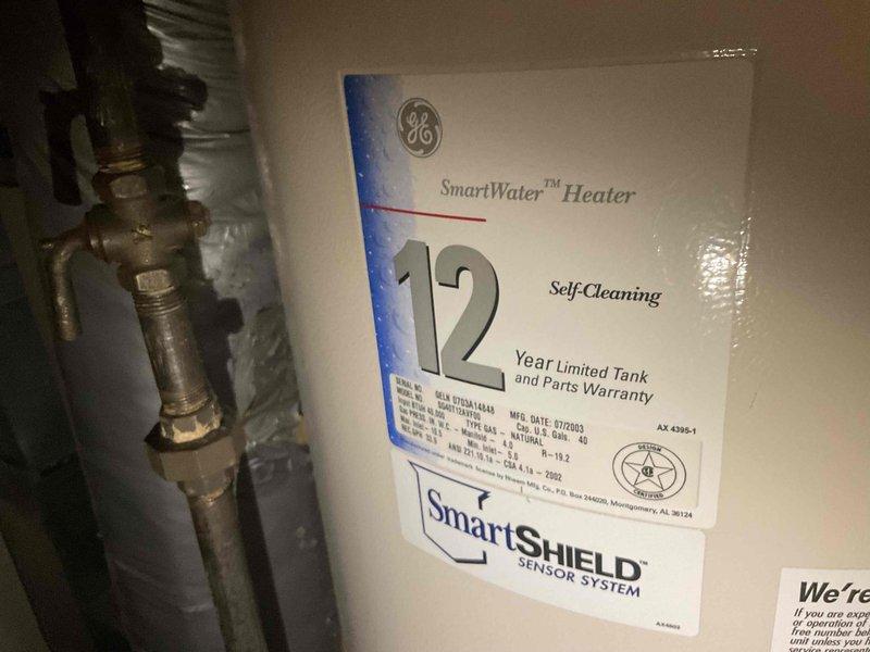 Responded to no hot water complaint and diagnosed 15-year-old GE SmartWater heater with active leak. Upon inspection, determined unit had reached end of serviceable life and recommended replacement. Provided estimate for new water heater installation due to age of existing equipment and active leak condition.