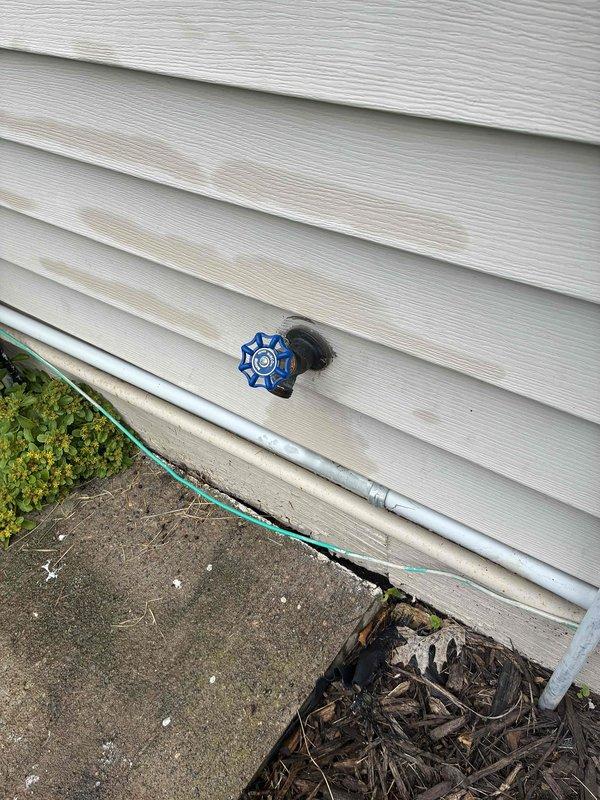 Responded to warranty callback for recently installed outdoor hose bibs. Upon arrival, identified loose packing nut on one spigot causing leak and difficult operation. Tightened packing nut to proper torque specification, resolving both the dripping issue and restoring smooth handle operation.