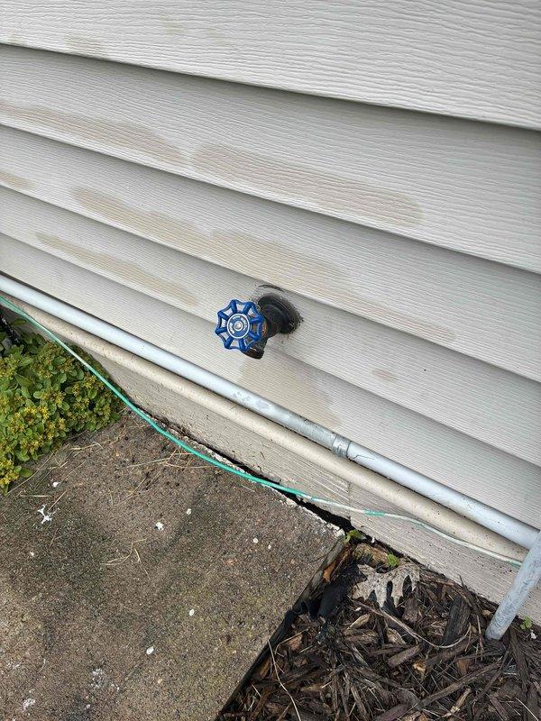Responded to warranty callback for recently installed outdoor hose bibs. Upon arrival, identified loose packing nut on one spigot causing leak and difficult operation. Tightened packing nut to proper torque specification, resolving both the dripping issue and restoring smooth handle operation.