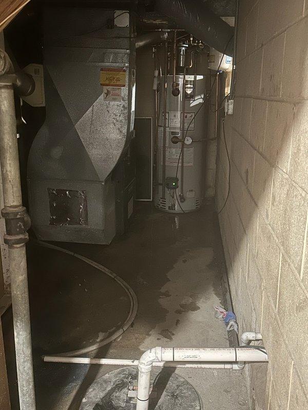 Responded to leaking overflow pipe on 11-year-old 50-gallon electric water heater. Upon arrival, water supply to home had been shut off by homeowner. Diagnosed faulty temperature and pressure relief valve as source of leak. Replaced defective T&P relief valve with new unit, restoring proper safety function and eliminating leak.