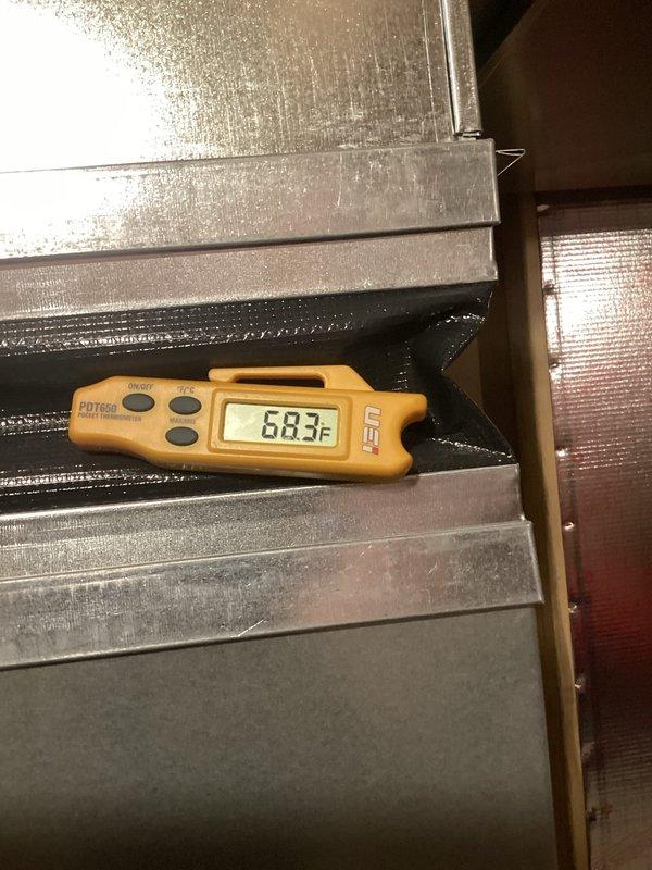 Responded to no-cool complaint on 2020 Bryant system running continuously without reaching setpoint. Upon arrival, system was maintaining 73°F and operating normally. Performed diagnostic testing which revealed proper system operation with 16-degree temperature split across evaporator coil, adequate refrigerant charge, clean air filter, and unobstructed return air pathways. Thermostat accuracy concerns were noted following recent battery replacement. All system parameters tested within normal operating range with no deficiencies identified at time of service.