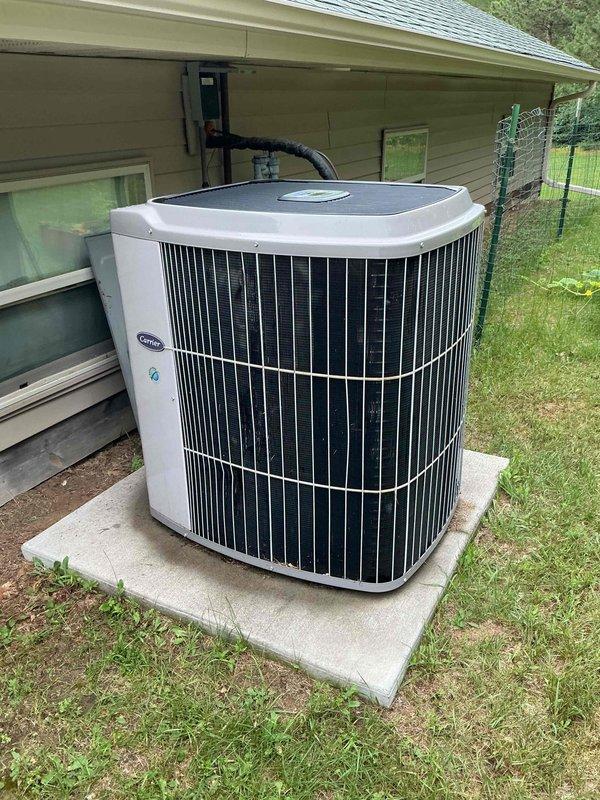 Responded to no cool complaint on Carrier condenser unit installed in 2023. Upon arrival, observed unit making chattering and clicking noises with intermittent operation. After allowing unit to run for 20 minutes to replicate the issue, diagnosed contactor rapidly cycling on and off, indicating potential pressure switch activation. Connected manifold gauges to refrigerant system and confirmed significantly low refrigerant charge, causing low pressure switch to trip and resulting in contactor clicking and inadequate cooling performance. Discussed repair options for refrigerant recharge and leak detection with homeowner, who declined service and opted to obtain replacement system estimates from other contractors. No repairs performed at this time. Recommended system replacement due to refrigerant loss on relatively new equipment.